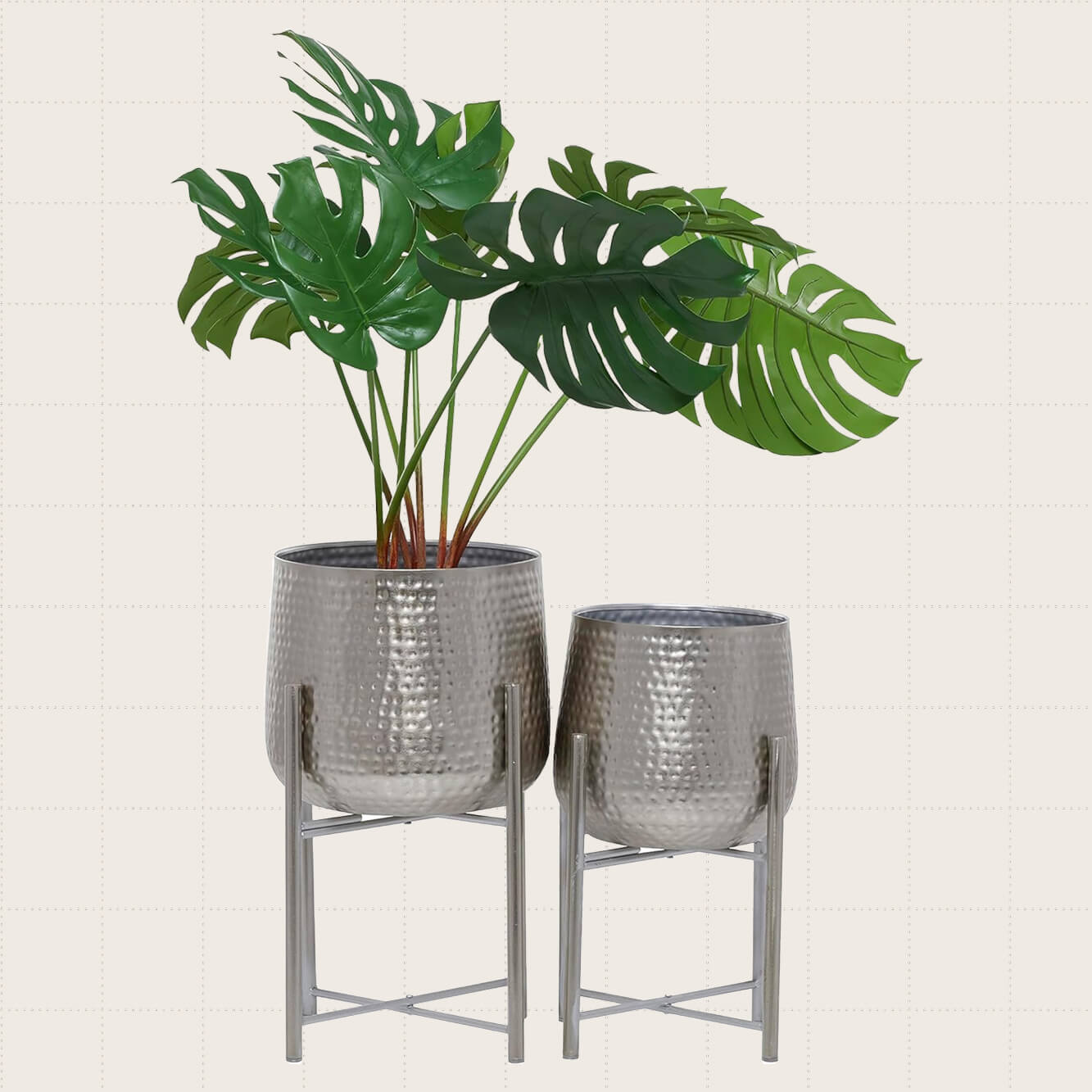 CosmoLiving Metal Indoor Outdoor Planters, Set of Two shown in silver.