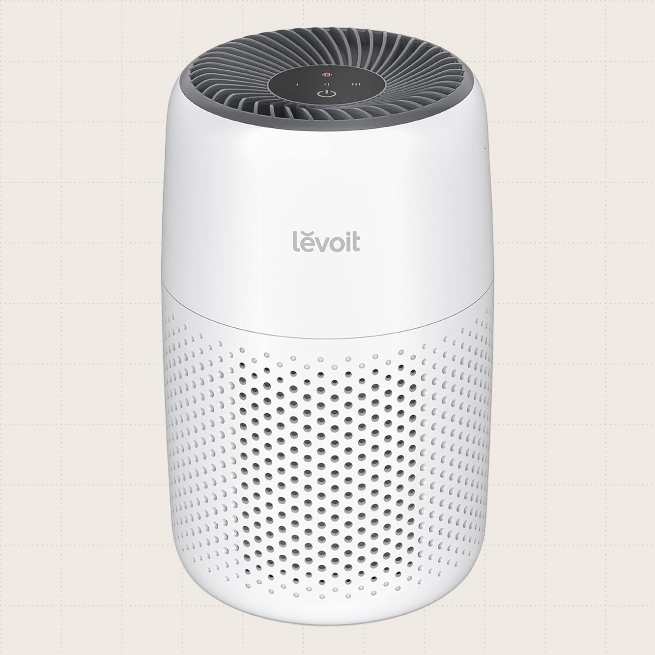 LEVOIT Core Mini Air Purifier, which is small enough to fit on a desk or countertop, shown against a beige background.