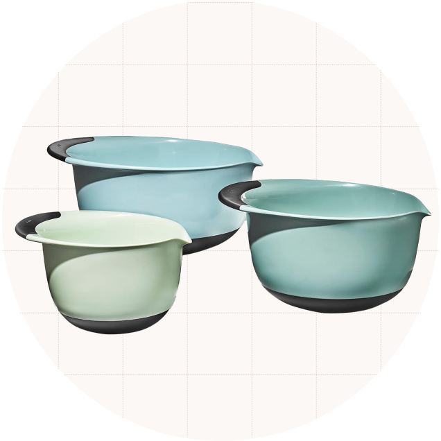 The OXO Good Grips Three-Piece Plastic Mixing Bowl Set shown in the blue colorway, which includes three different shades of light blue/green.